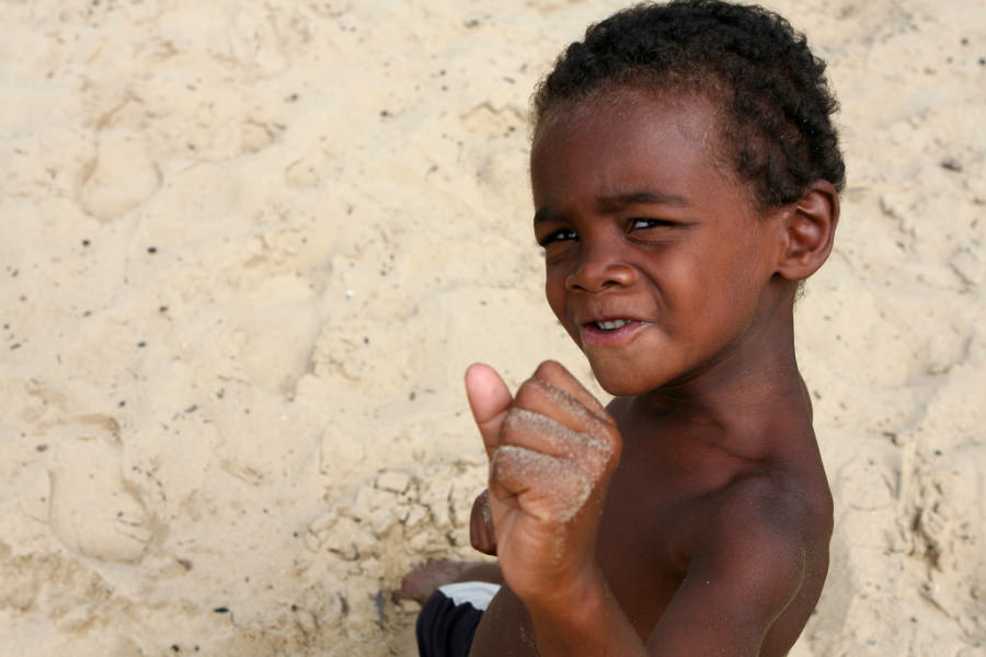 A young Malagasy posing for tourists